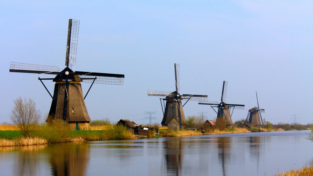 Four windmills standing on the canal in Kinderdijk Holland