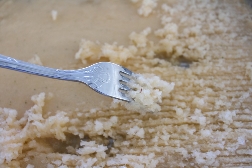 Scraping the melon granita in the pan