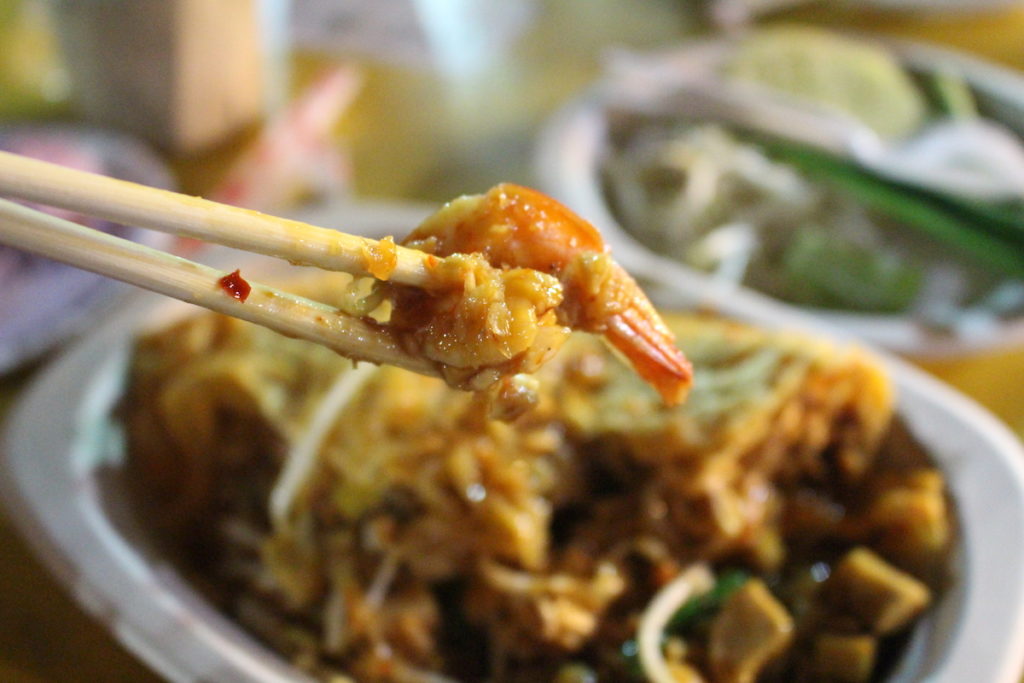 A shrimp held in chopsticks from my Pad Thai at the Krabi Night Market 