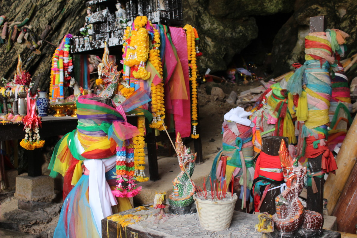 The Princess cave at Phra Nang Beach in Railay Beach, Thailand. The altar at the entrance.