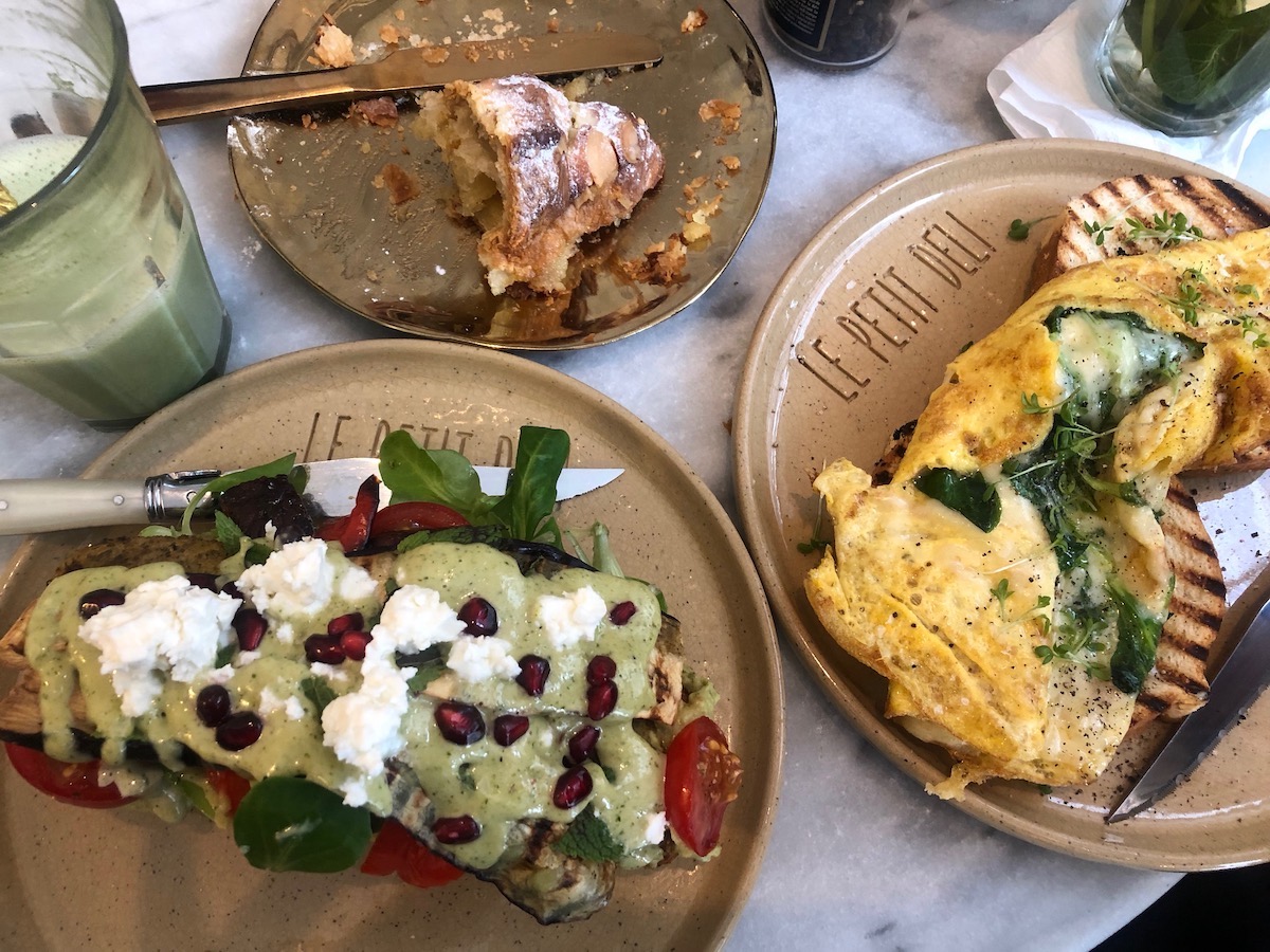 Brunch at Le Petit Deli, Amsterdam. The avocado and goat cheese toast, a French omelette and a croissant