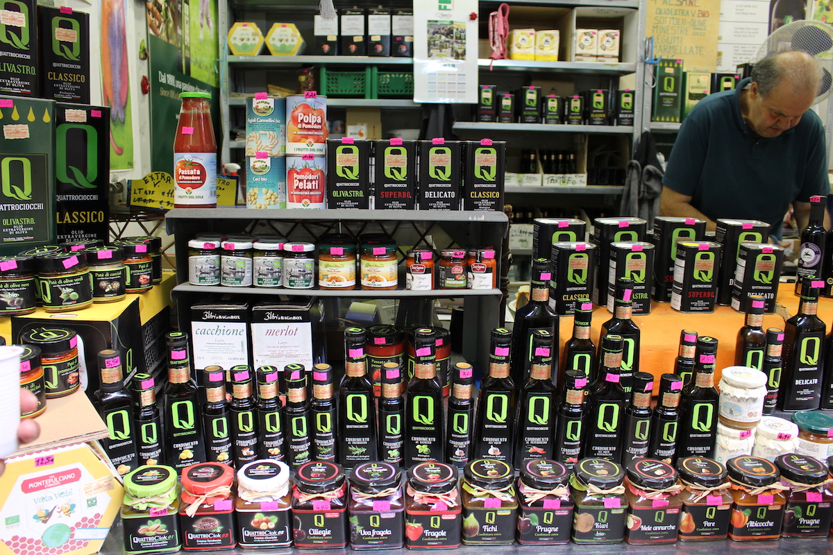 Dozens of varieties of olive oil behind the counter