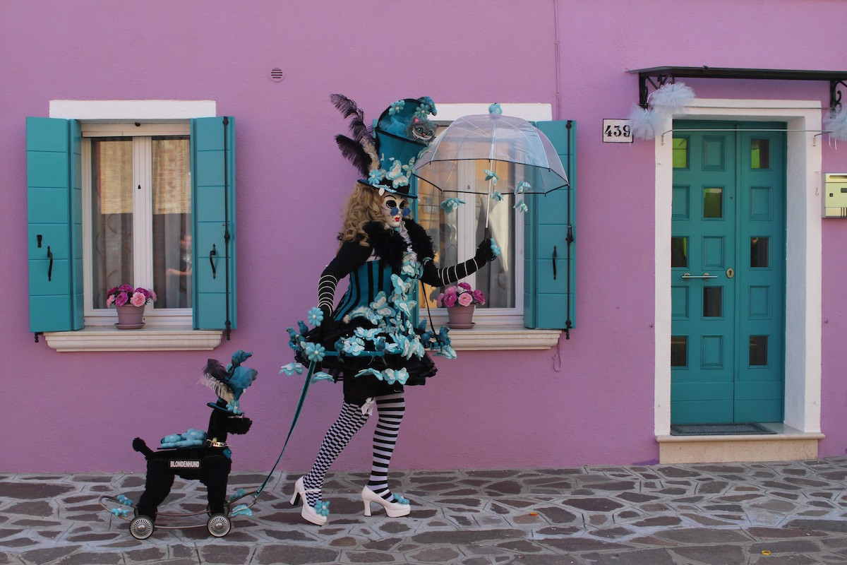A woman posing in Burano for the costume contest in Venice during Carnival