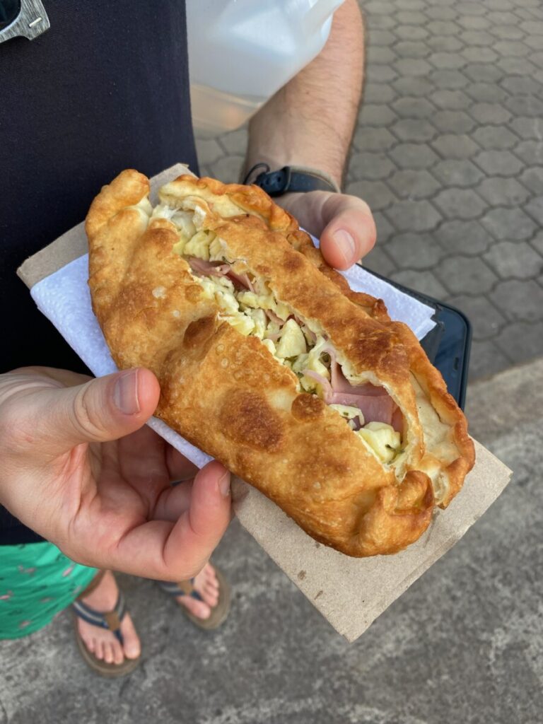 Warm empanada filled with meat and cheese. Where to eat in Puerto Ayora: Empanadas. 
