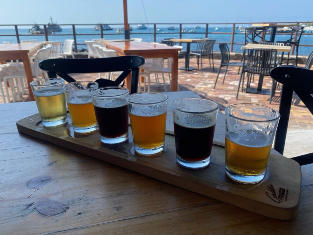 Enjoying beers by Playa Marinos