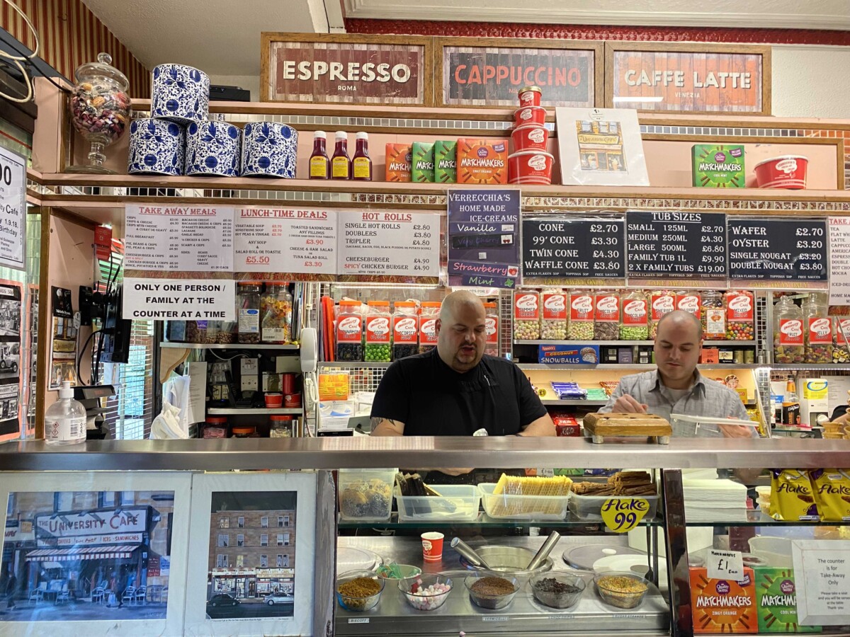 Behind the counter at the University Cafe, 2 men