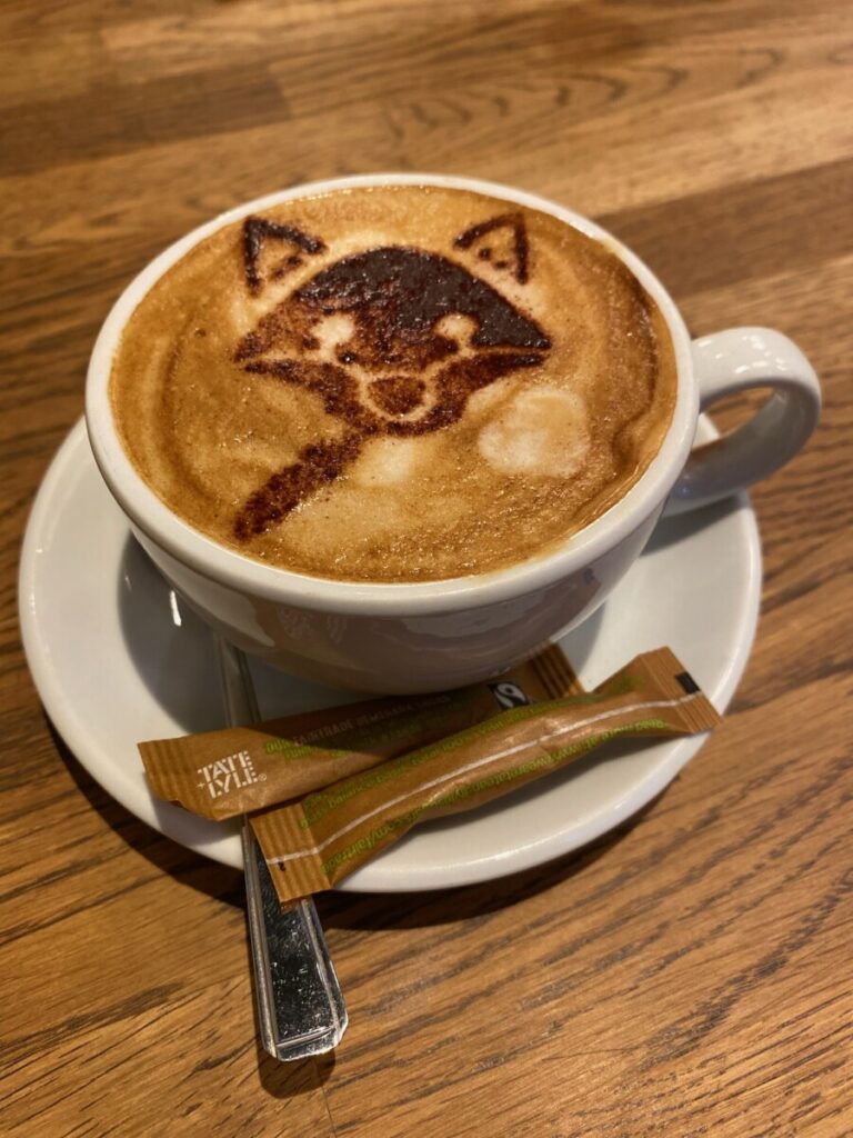 A cappuccino with a fox dusted atop