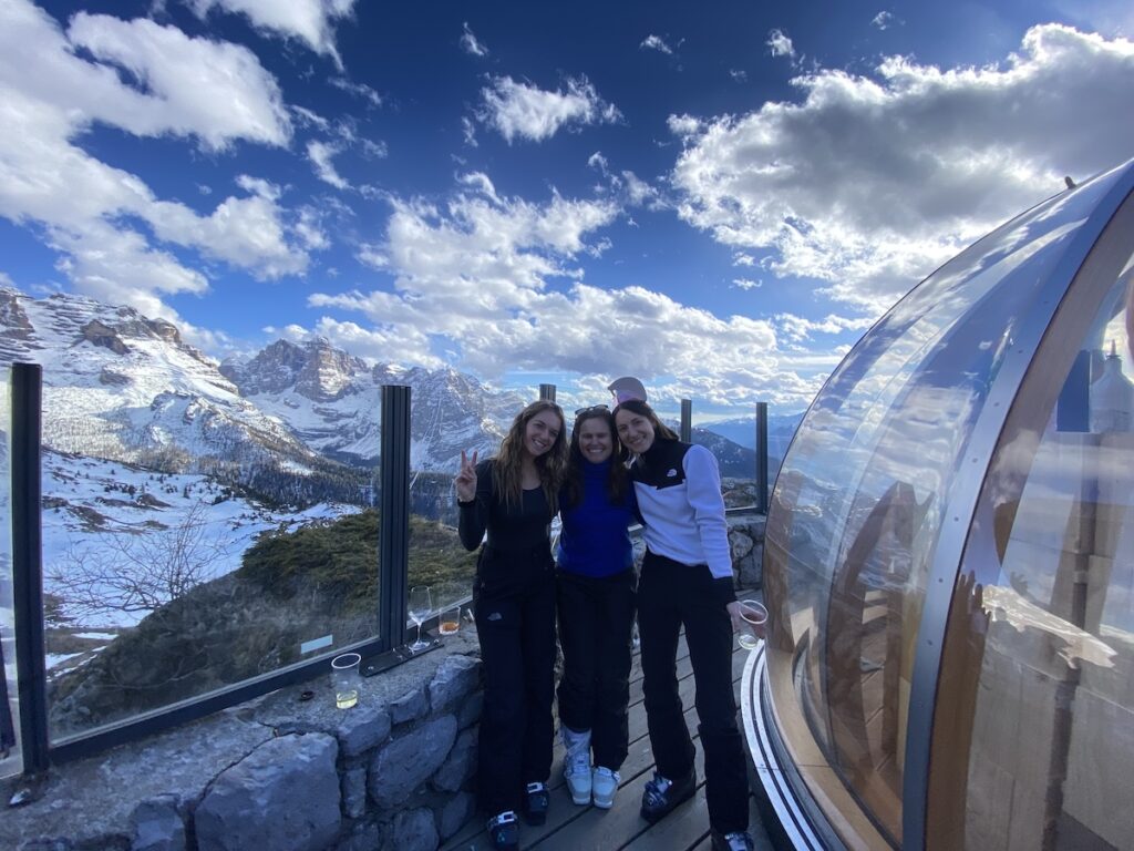 Me and my girlfriends at Chalet Spinale with the mountains behind us