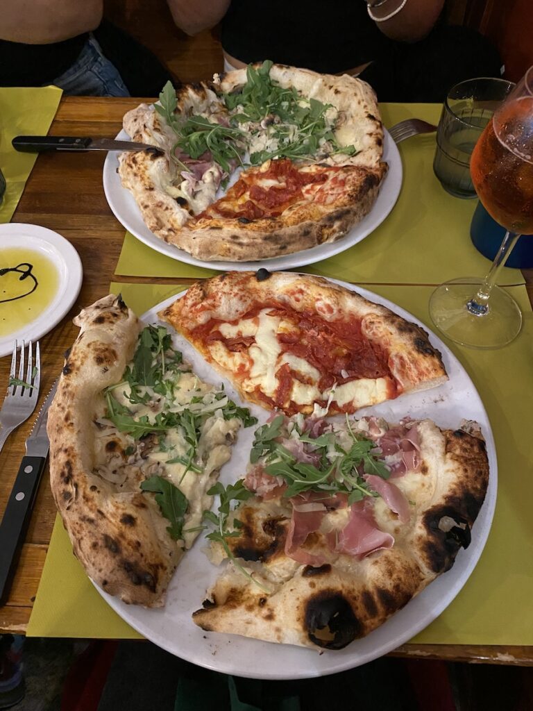2 plates of pizza, 3 different toppings at Bella Storia