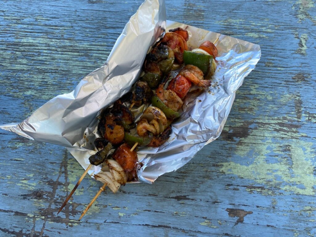 Chicken skewers with vegetables from a street vendor 